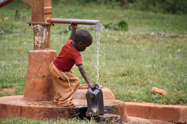 Drilling a well with a hand pump in the remote village of Mudnani in Ivory Coast